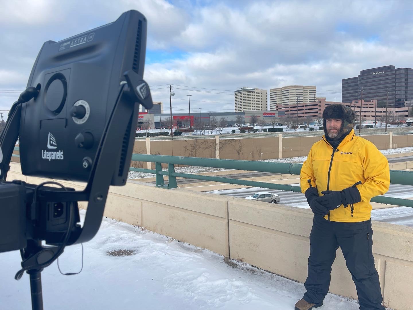 Scott Withers set up for a live winter-storm report on a snowy overpass